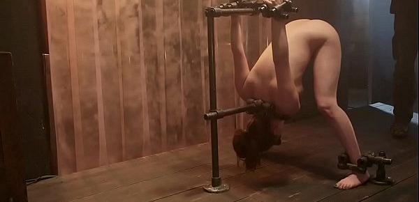  Brunette in custom made device flogged